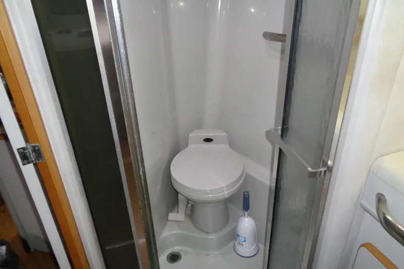 Snri Yacht Photos Pics Compact bathroom in 1991 Sea Ray 480 Sundancer yacht with toilet and shower.