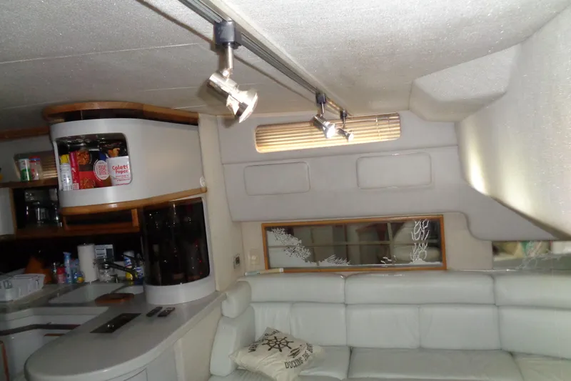 Snri Yacht Photos Pics Interior of 1991 Sea Ray 480 Sundancer yacht with modern seating and kitchen area.