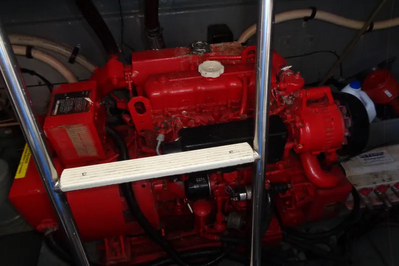 Snri Yacht Photos Pics Engine compartment of a 1991 Sea Ray 480 Sundancer, featuring a red marine engine.