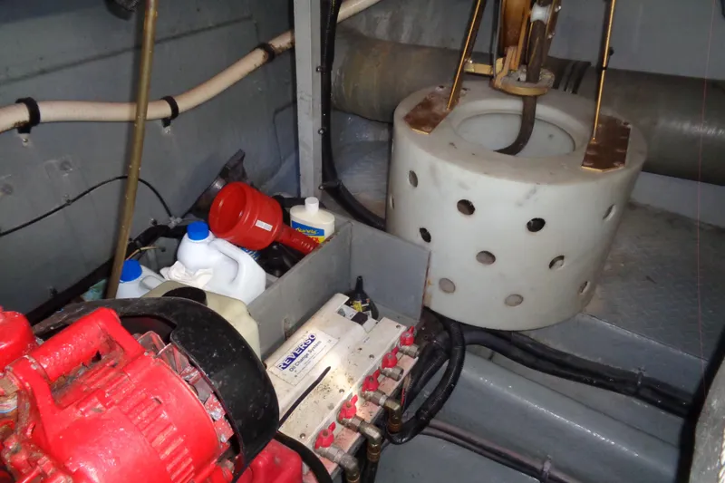 Snri Yacht Photos Pics Engine room of 1991 Sea Ray 480 Sundancer with equipment and maintenance supplies.