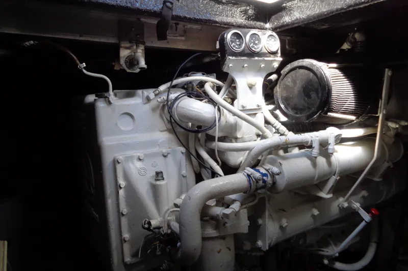 Snri Yacht Photos Pics Engine compartment of a 1991 Sea Ray 480 Sundancer boat, showcasing mechanical components.