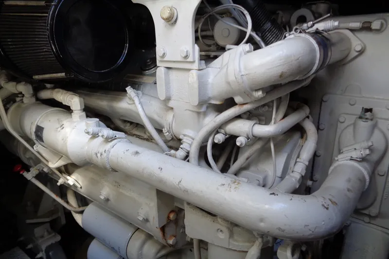 Snri Yacht Photos Pics Engine components of a 1991 Sea Ray 480 Sundancer boat, showcasing intricate piping and machinery.