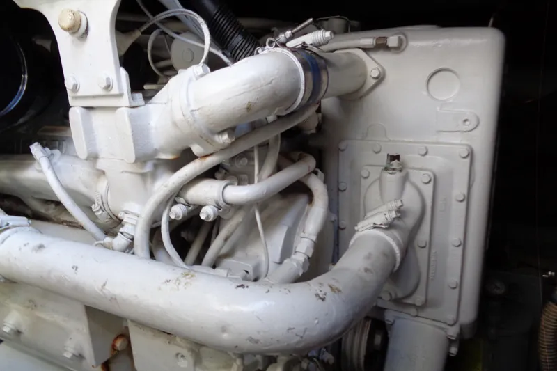 Snri Yacht Photos Pics Engine components of a 1991 Sea Ray 480 Sundancer boat, showcasing pipes and mechanical details.