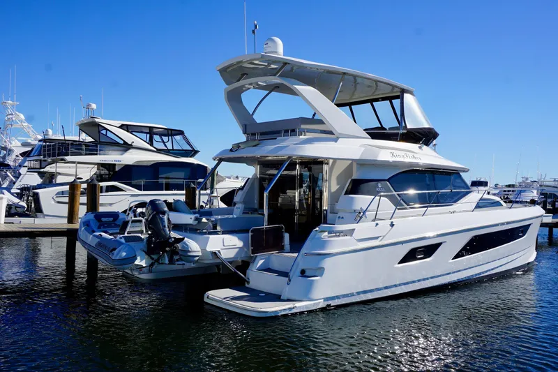  Yacht Photos Pics Aquila 44 Yacht 2020 docked at marina under clear blue sky.