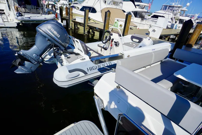  Yacht Photos Pics Aquila 44 Yacht 2020 with Yamaha motor and Highfield inflatable boat at marina.