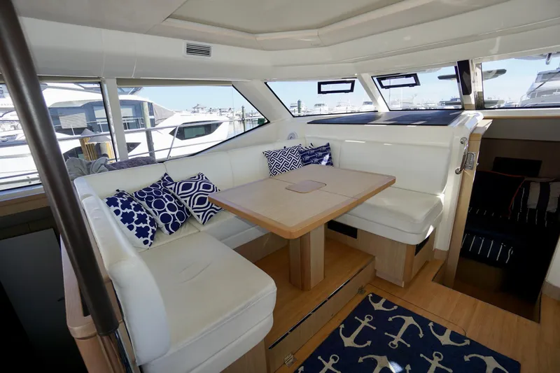  Yacht Photos Pics Interior of 2020 Aquila 44 Yacht with white seating and nautical-themed decor.