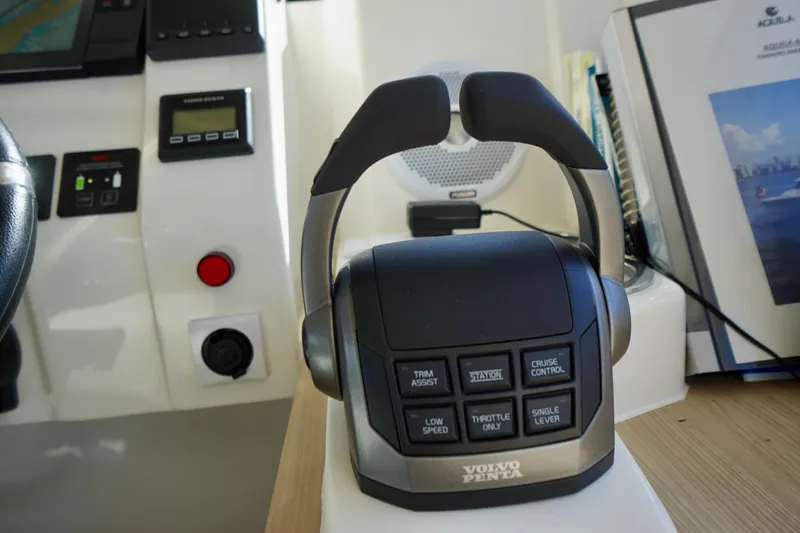  Yacht Photos Pics Volvo Penta control panel on 2020 Aquila 44 Yacht dashboard, featuring various operational buttons.