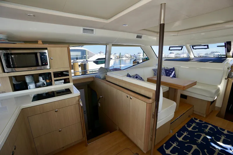  Yacht Photos Pics Luxurious interior of 2020 Aquila 44 Yacht with modern kitchen and seating area.