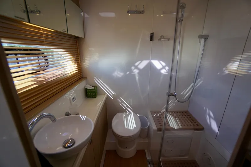  Yacht Photos Pics Modern bathroom interior on 2020 Aquila 44 Yacht with shower and sink.
