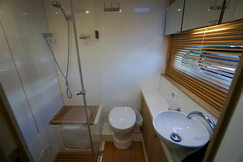  Yacht Photos Pics Modern bathroom in 2020 Aquila 44 Yacht with shower, toilet, and sink.