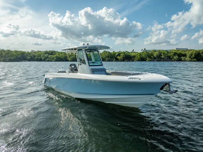 Clear To Close Yacht Photos Pics 2023 Boston Whaler 280 Outrage boat cruising on a sunny day.