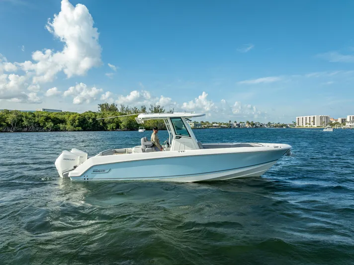 Clear To Close Yacht Photos Pics 2023 Boston Whaler 280 Outrage boat cruising on a sunny day in open water.