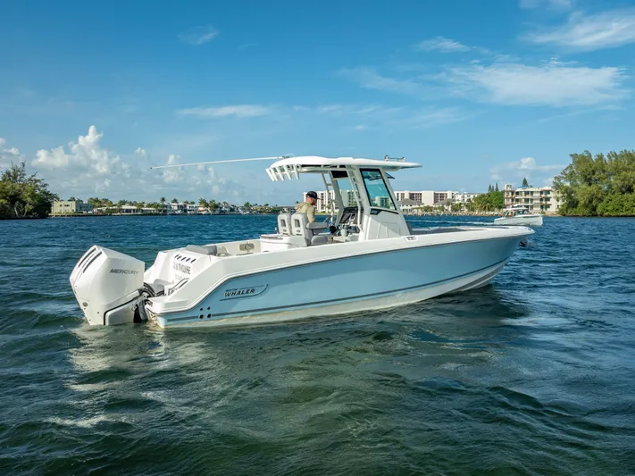 Clear To Close Yacht Photos Pics 2023 Boston Whaler 280 Outrage boat cruising on a sunny day.