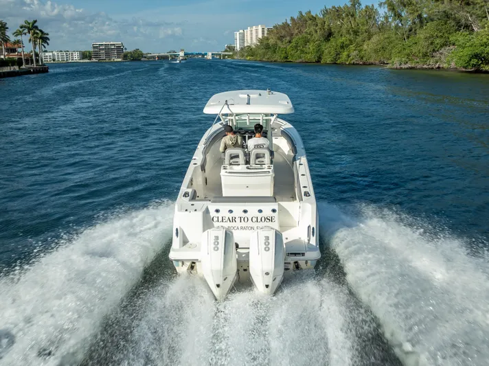 Clear To Close Yacht Photos Pics 2023 Boston Whaler 280 Outrage cruising on a scenic waterway.