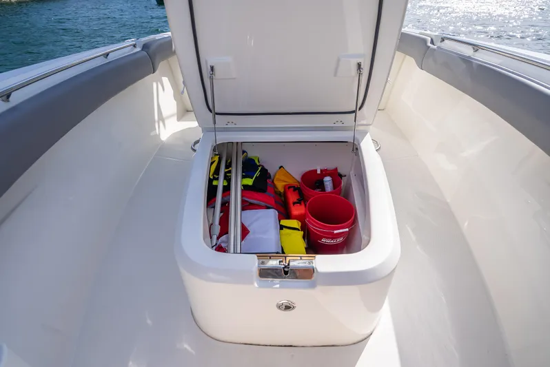 Clear To Close Yacht Photos Pics 2023 Boston Whaler 280 Outrage storage compartment with safety gear and equipment.
