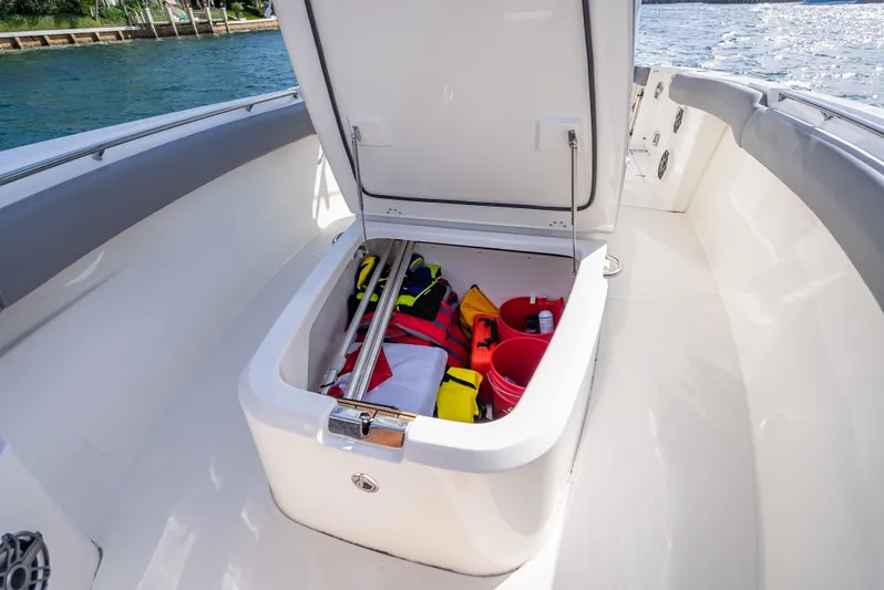 Clear To Close Yacht Photos Pics 2023 Boston Whaler 280 Outrage storage compartment with safety gear and equipment.