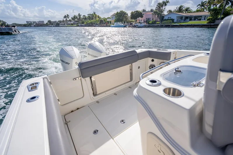 Clear To Close Yacht Photos Pics 2023 Boston Whaler 280 Outrage boat on water, featuring dual outboard engines and sleek deck design.