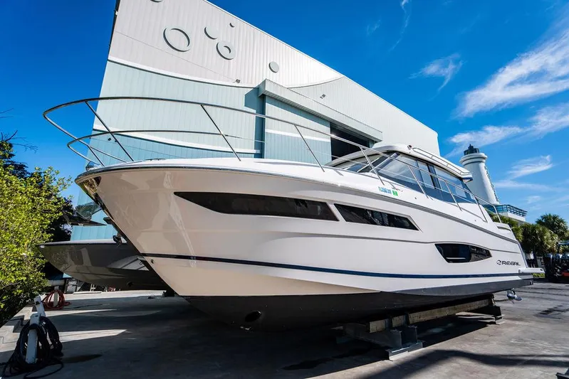 2021 Regal 38 Xo Yacht Photos Pics 2021 Regal 38 XO yacht docked outdoors under a clear blue sky.