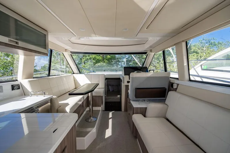 2021 Regal 38 Xo Yacht Photos Pics Luxurious interior of 2021 Regal 38 XO yacht with modern seating and panoramic windows.