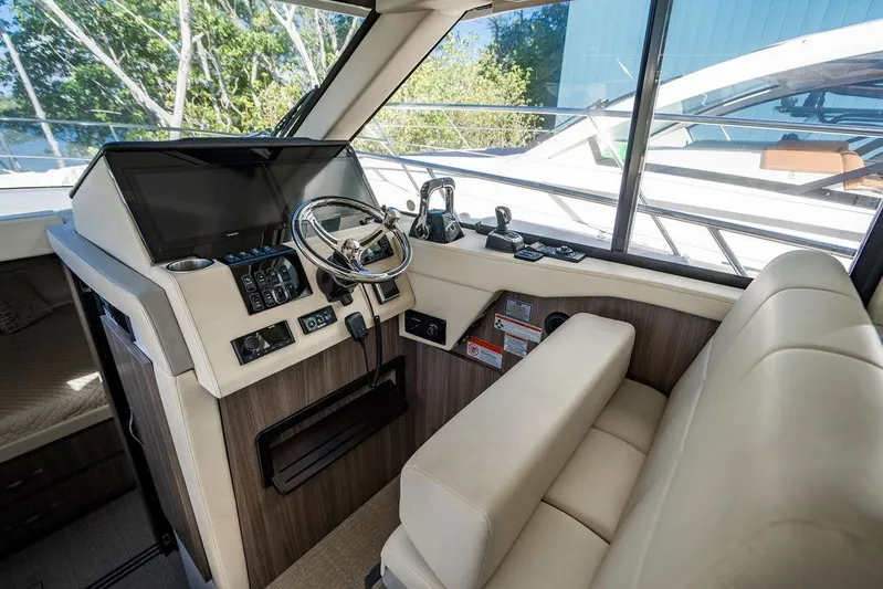 2021 Regal 38 Xo Yacht Photos Pics 2021 Regal 38 XO yacht helm with modern controls and comfortable seating.