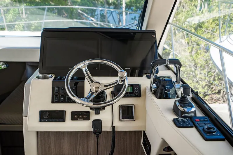 2021 Regal 38 Xo Yacht Photos Pics 2021 Regal 38 XO helm with modern controls and sleek steering wheel.