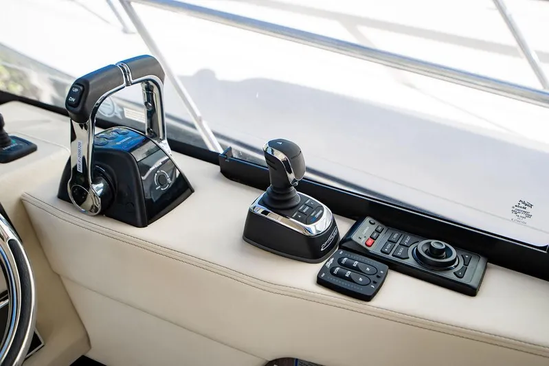 2021 Regal 38 Xo Yacht Photos Pics Control panel of 2021 Regal 38 XO yacht with joystick and throttle.