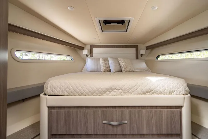2021 Regal 38 Xo Yacht Photos Pics 2021 Regal 38 XO cabin interior with bed and modern design.
