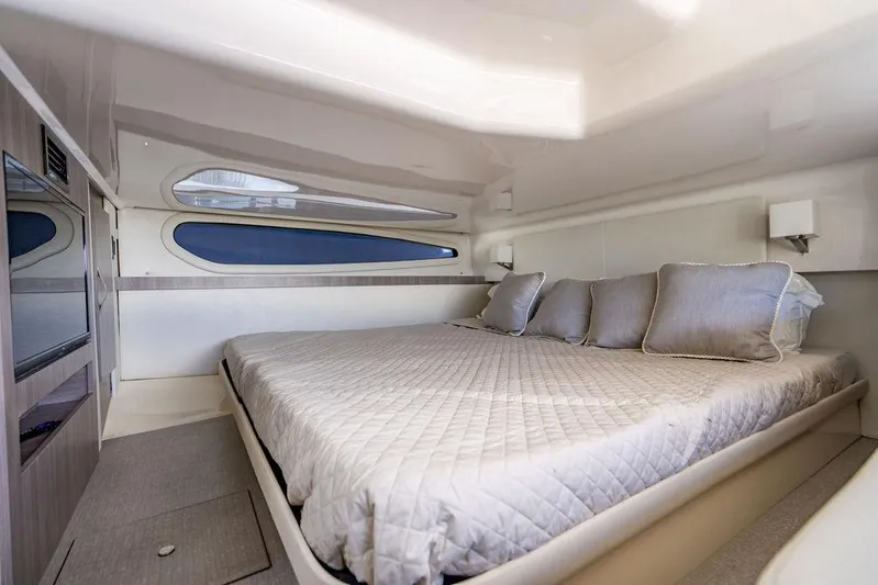 2021 Regal 38 Xo Yacht Photos Pics Luxurious cabin interior of 2021 Regal 38 XO yacht with comfortable bedding.