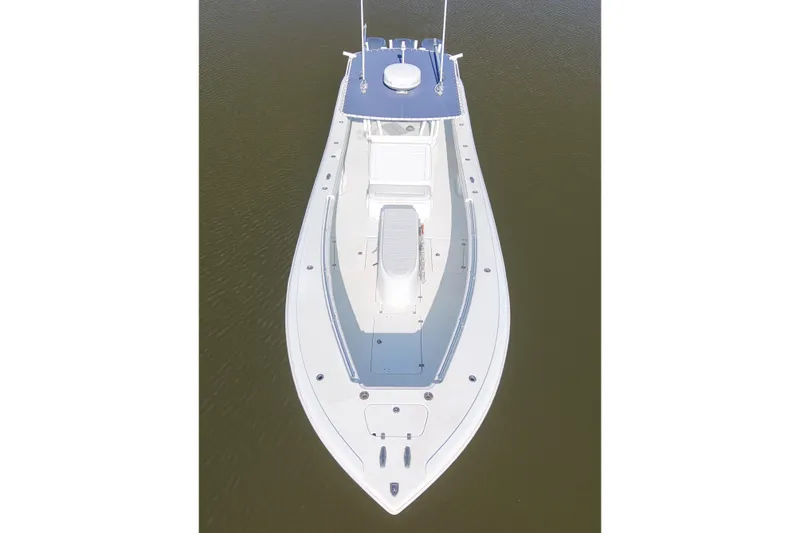  Yacht Photos Pics 2006 Yellowfin 36 Offshore boat, aerial view, sleek design, white and blue color scheme.