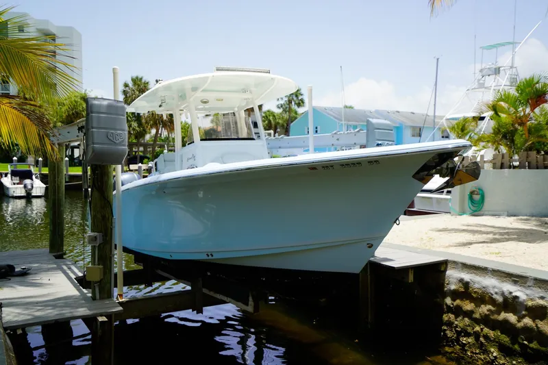  Yacht Photos Pics 2016 Sea Hunt Gamefish 30 boat docked near palm trees and waterfront homes.