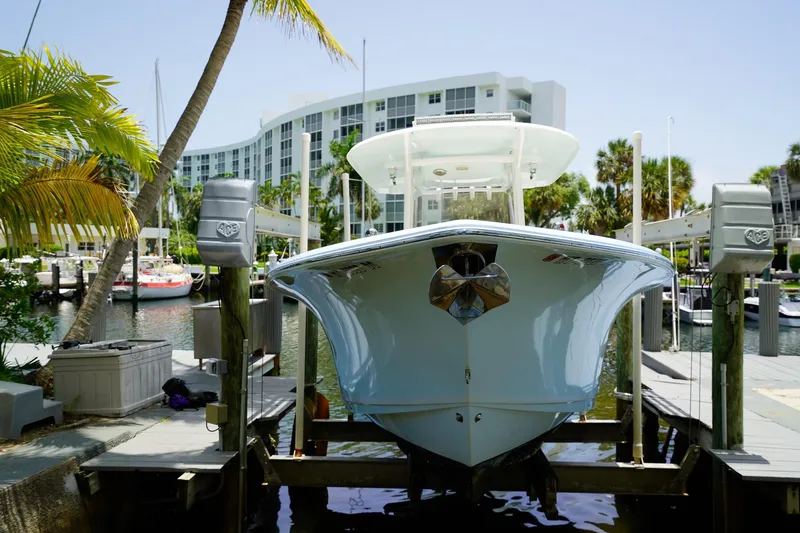  Yacht Photos Pics 2016 Sea Hunt Gamefish 30 boat docked at marina with palm trees and modern building.