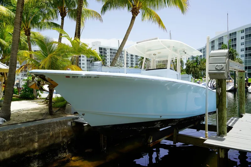  Yacht Photos Pics 2016 Sea Hunt Gamefish 30 boat docked near palm trees and waterfront buildings.