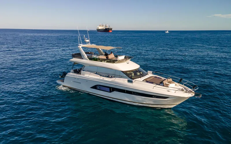 Knightlife Yacht Photos Pics Luxury 2017 Prestige 630 yacht cruising on open sea under clear skies.