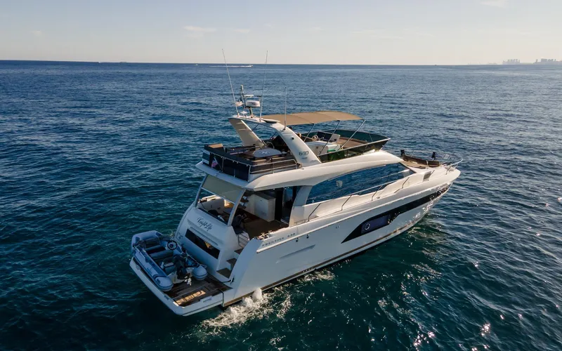 Knightlife Yacht Photos Pics Luxury 2017 Prestige 630 yacht cruising on open sea under clear sky.