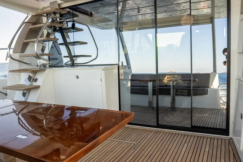 Knightlife Yacht Photos Pics Luxurious 2017 Prestige 630 yacht interior with wooden deck and glass doors.