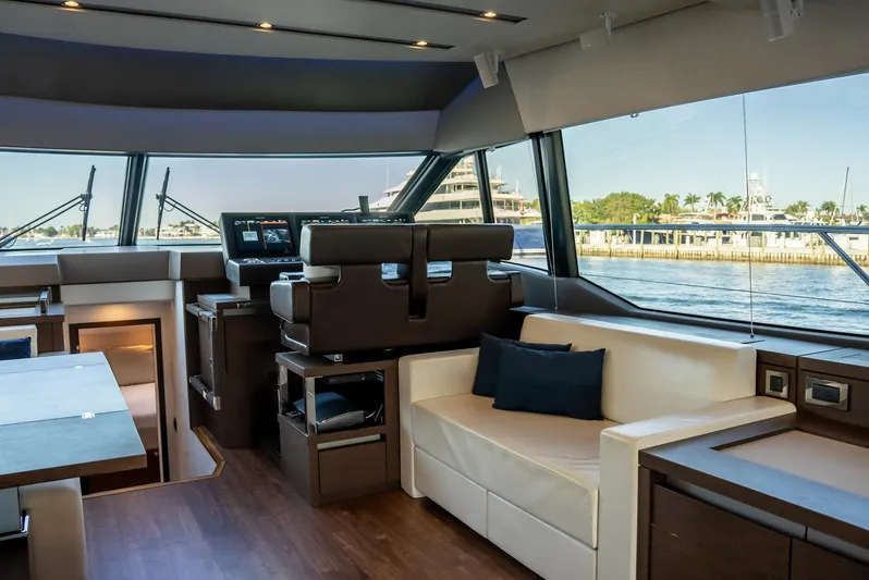 Knightlife Yacht Photos Pics Luxurious interior of a 2017 Prestige 630 yacht with modern seating and panoramic windows.