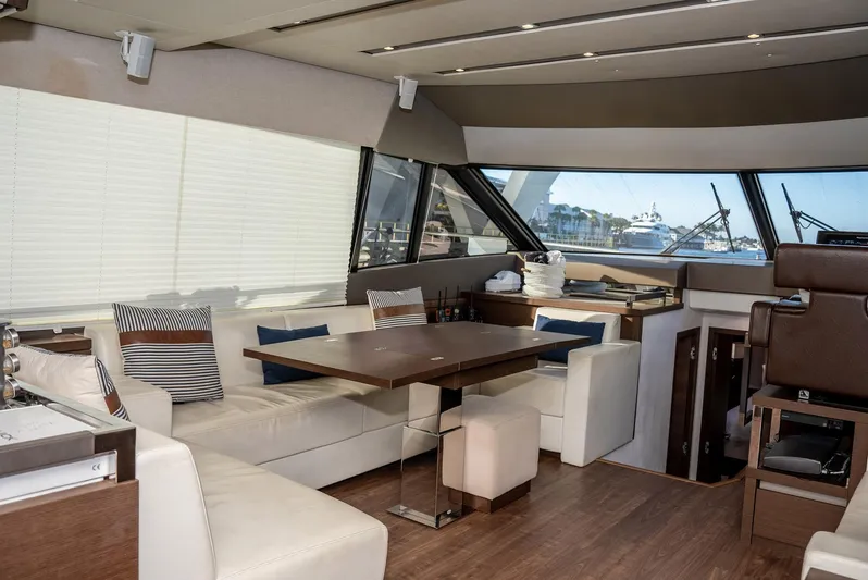Knightlife Yacht Photos Pics Luxurious interior of a 2017 Prestige 630 yacht with elegant seating and dining area.