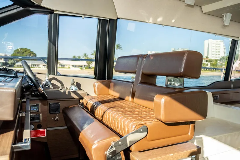 Knightlife Yacht Photos Pics Luxurious interior of 2017 Prestige 630 yacht with leather seating and panoramic windows.