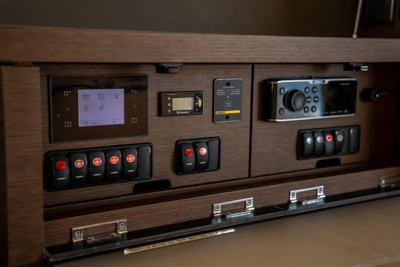 Knightlife Yacht Photos Pics Control panel of a 2017 Prestige 630 yacht with switches and digital displays.