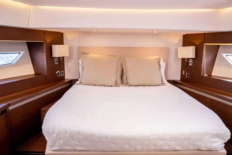 Knightlife Yacht Photos Pics Luxurious bedroom interior of 2017 Prestige 630 yacht with elegant bedding and ambient lighting.