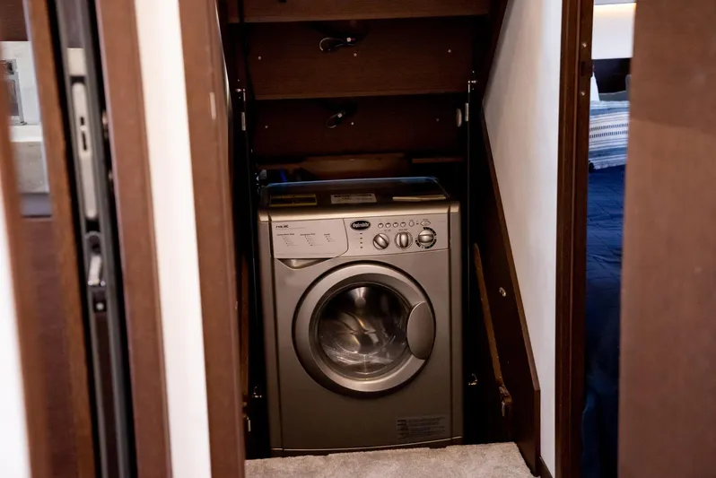 Knightlife Yacht Photos Pics Compact washing machine in a 2017 Prestige 630 yacht interior space.