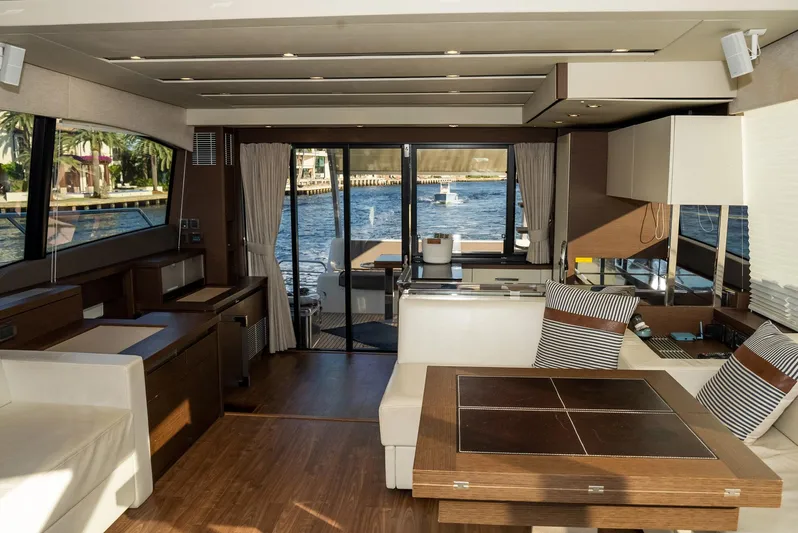Knightlife Yacht Photos Pics Luxurious interior of a 2017 Prestige 630 yacht with modern furnishings and waterfront view.