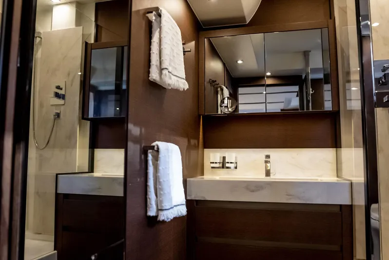 Knightlife Yacht Photos Pics Luxurious bathroom interior of 2017 Prestige 630 yacht with modern fixtures and elegant design.