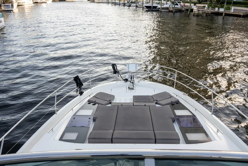 Knightlife Yacht Photos Pics Prestige 630 yacht (2017) with sunbathing area on calm water.