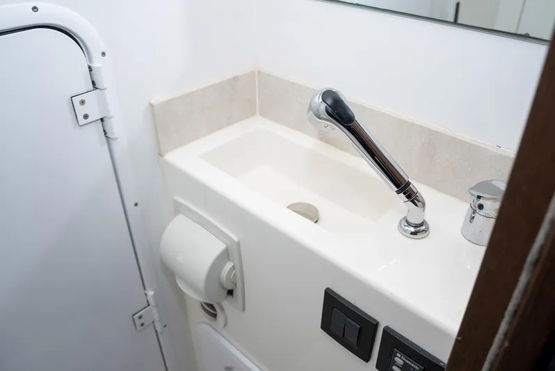 Knightlife Yacht Photos Pics Bathroom sink area in a 2017 Prestige 630 yacht, featuring modern fixtures.