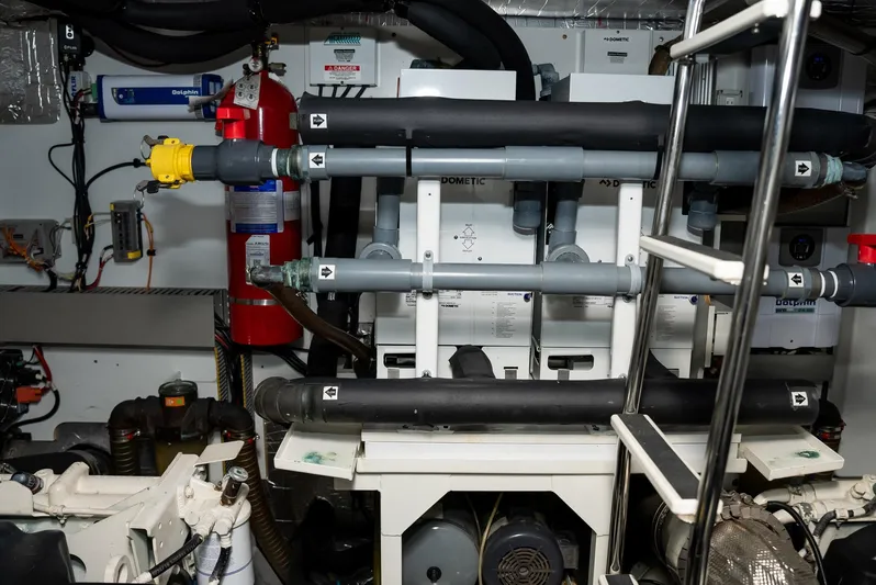 Knightlife Yacht Photos Pics Engine room of a 2017 Prestige 630 yacht with visible pipes and equipment.