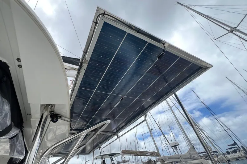 Ile En Ile Yacht Photos Pics Solar panels on a 2018 Lagoon 42 catamaran under cloudy sky.