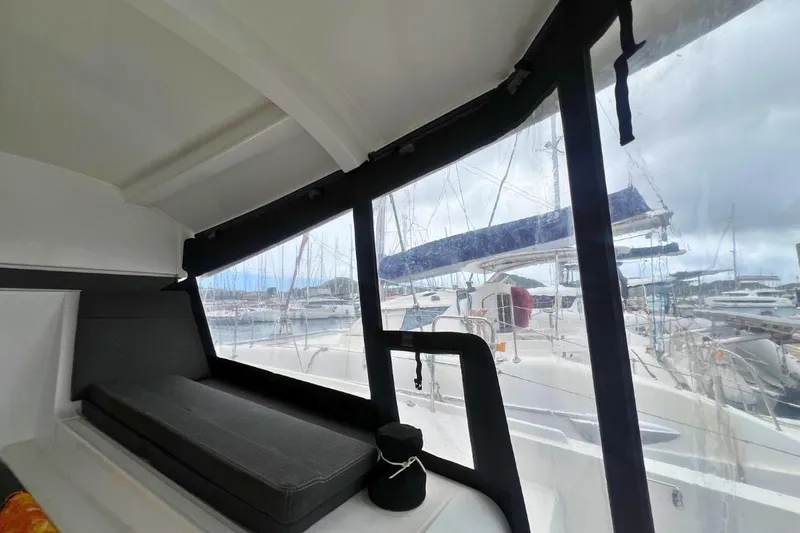Ile En Ile Yacht Photos Pics Interior view of a 2018 Lagoon 42 catamaran with marina backdrop.
