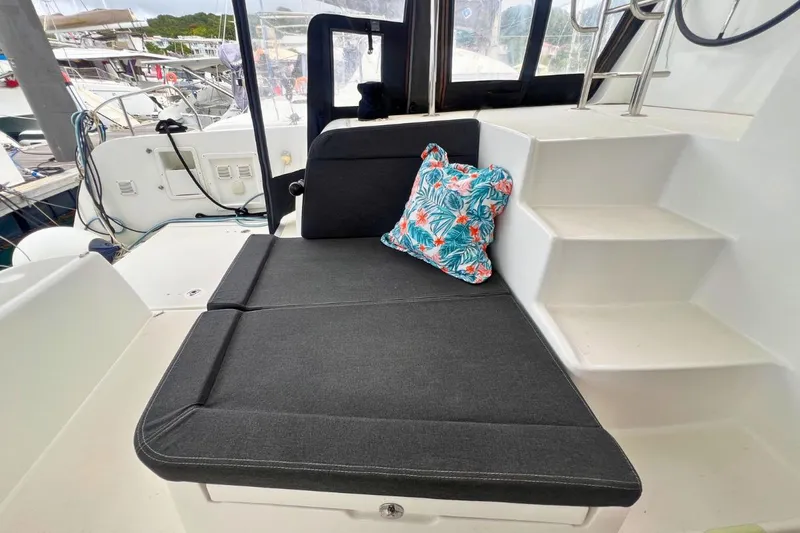 Ile En Ile Yacht Photos Pics Cozy seating area on 2018 Lagoon 42 catamaran with floral cushion.