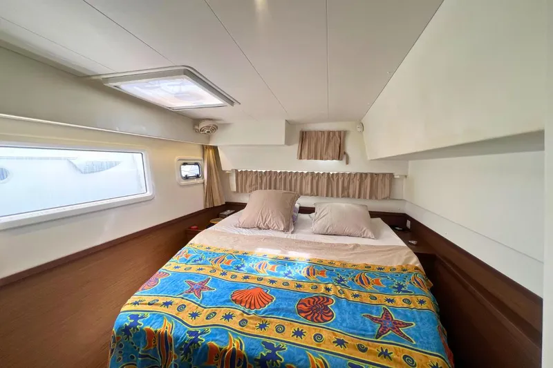 Ile En Ile Yacht Photos Pics Cozy bedroom in 2018 Lagoon 42 yacht with colorful seashell-themed bedding.